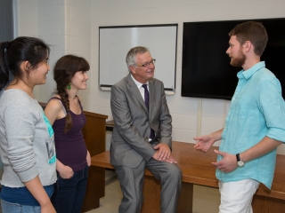 An image of Professor Reithmeier with students.